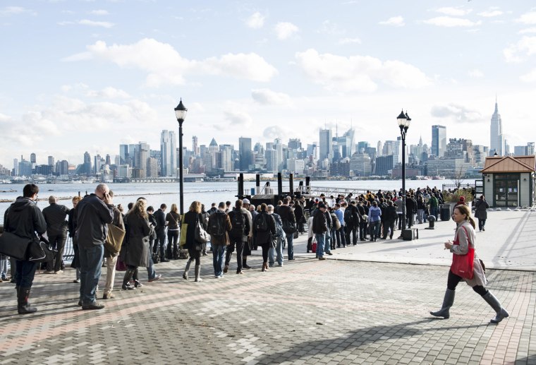With limited functioning transportation options, people wait for ferry tickets to Manhattan on Oct. 31, 2012, in Hoboken, N.J.