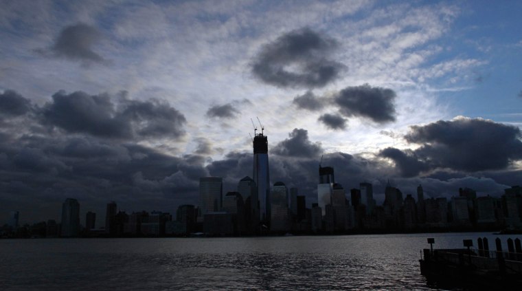 A dark lower Manhattan is seen from a NY Waterways ferry in Jersey City, N.J., on the morning of Oct. 31.