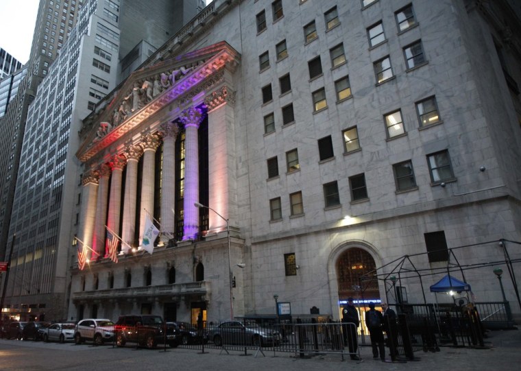 Traders and staff report to work at the New York Stock Exchange on Wednesday.