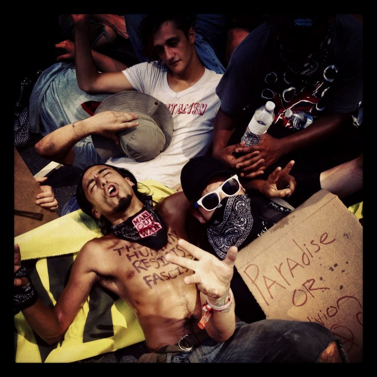 Occupy protesters demonstrate in front of the Bank of America headquarters before the start of the DNC, Sept. 2, in Charlotte, N.C. Image shot on an iPhone.