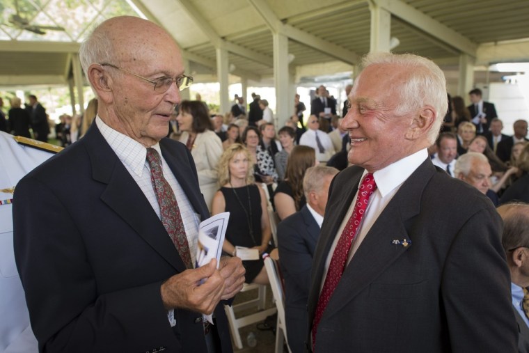 Apollo 11 Astronauts Michael Collins, left, and Buzz Aldrin talk at a private memorial service celebrating the life of Neil Armstrong, at the Camargo Club in Cincinnati, Ohio, Friday.