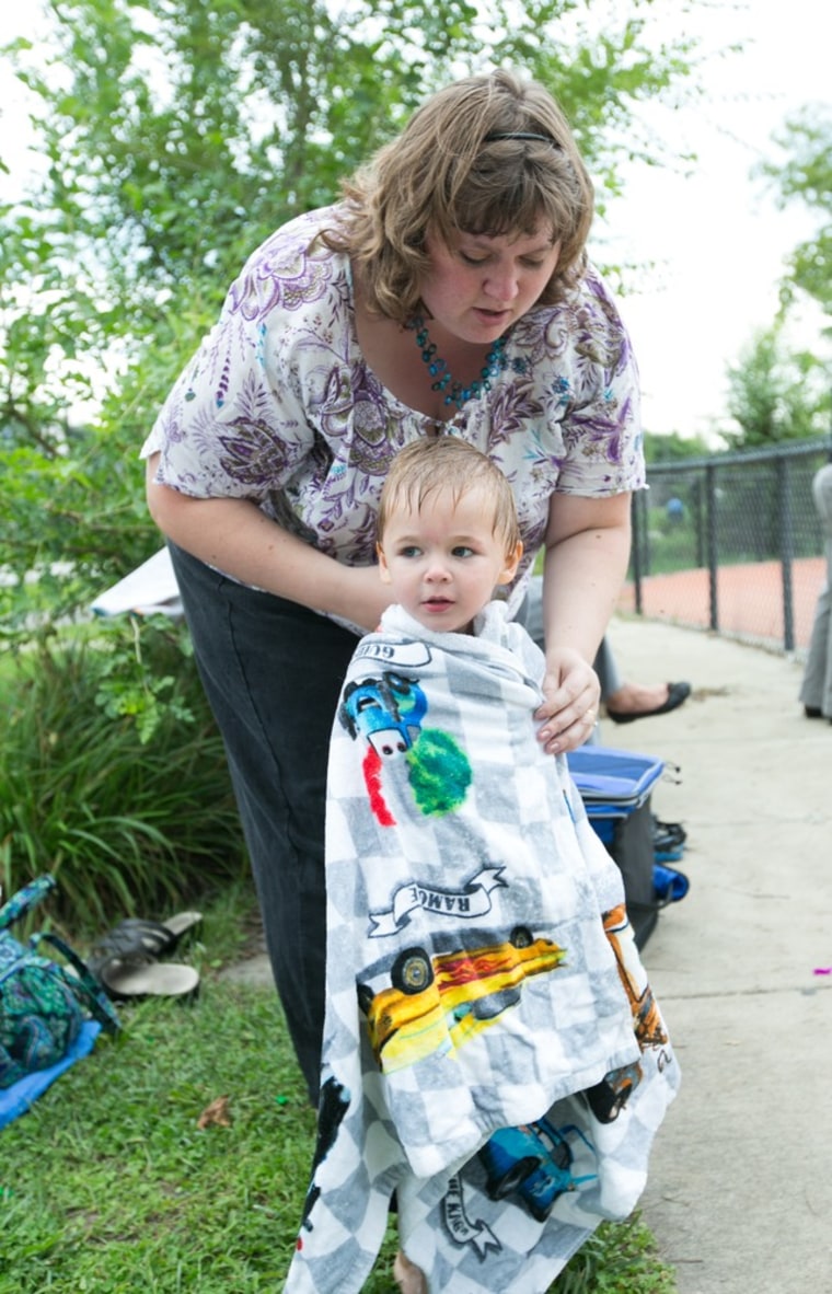 Cindee Goodling helps dry Collin at a water park in South Bend. She cherishes family events with her son, whose nickname is Zap, after the defibrillator shocks it took to restart her heart when she was pregnant with him.