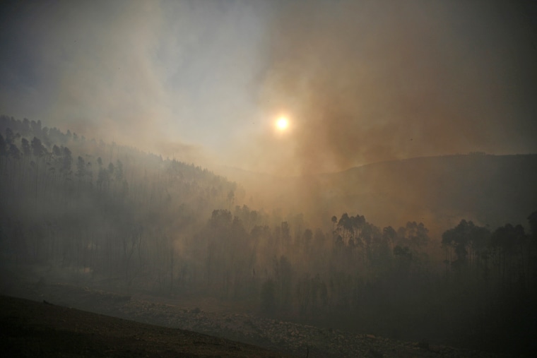 Smoke from a forest fire fills the air in Alvaiazere, near Ourem, Portugal, on Sept. 4.