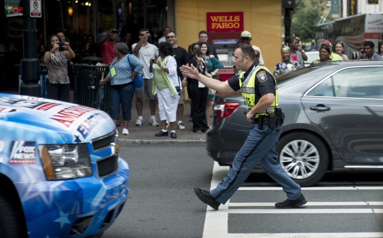 Deputy John Strutko, of the Clayton Georgia County Sheriff department, directs traffic while people arrive for the second day of the 2012 Democratic National Convention.