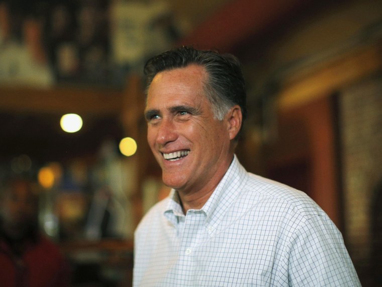 Republican presidential candidate and former Massachusetts Governor Mitt Romney talks briefly with reporters after stopping to buy two pizzas at Lui-Lui restaurant in West Lebanon, New Hampshire September 5, 2012.