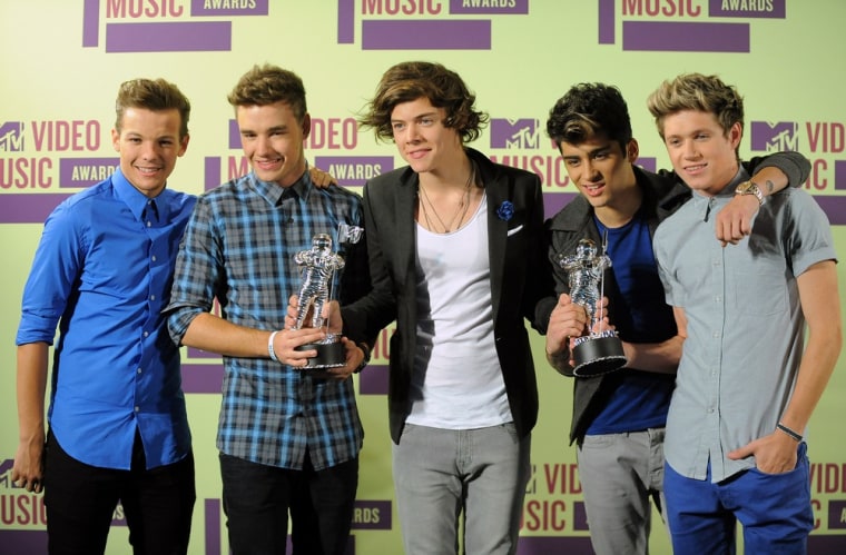 Members of the British band One Direction, from left, Louis Tomlinson, Liam Payne, Harry Styles, Zayn Malik and Niall Horan pose backstage with their awards at the MTV Video Music Awards on Thursday.