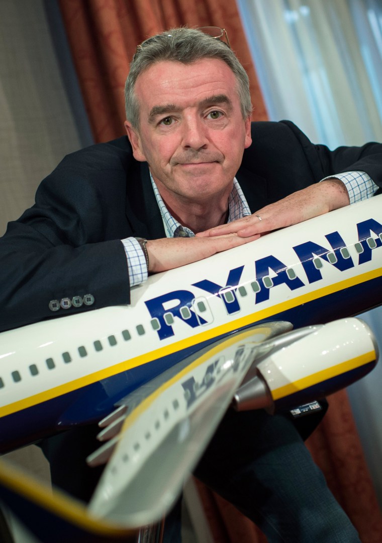 CEO of Irish airline Ryanair Michael O'Leary poses on a model jet at a press conference in Madrid on Aug. 23.