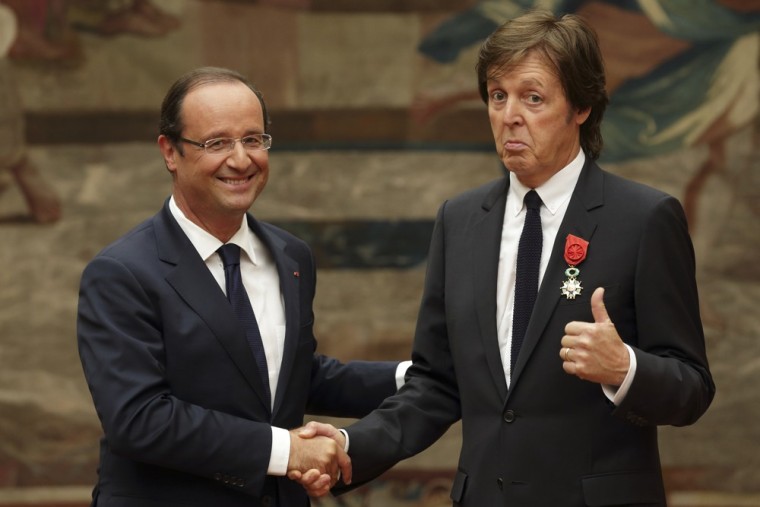 French President Francois Hollande, left, awards Paul McCartney during a decoration ceremony photo session at the Elysee Palace in Paris on Saturday, Sept. 8.