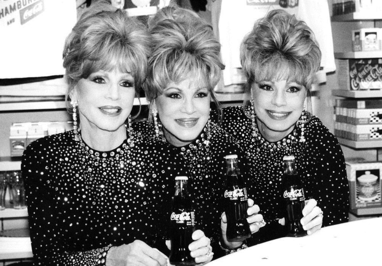 Dorothy, right, was joined by her sisters Christine, left, and Phyllis at the opening of the World of Coca-Cola in Las Vegas on July 7, 1997.