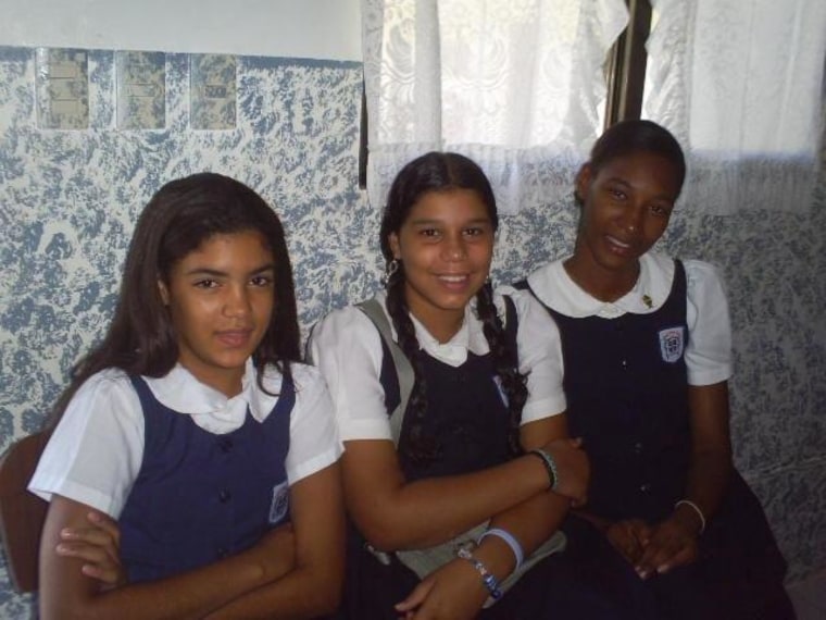 Fior Mendez (right) in her school uniform as a child at the orphanage.