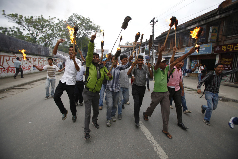 Nepalese students affiliated to various political parties participate in a torch rally against the hike in fuel prices in Katmandu, Nepal, on Sept. 11. The rise in prices came into effect last week and student organizations say the protest will carry on until the government addresses their demand of relieving the price hike, according to news reports.