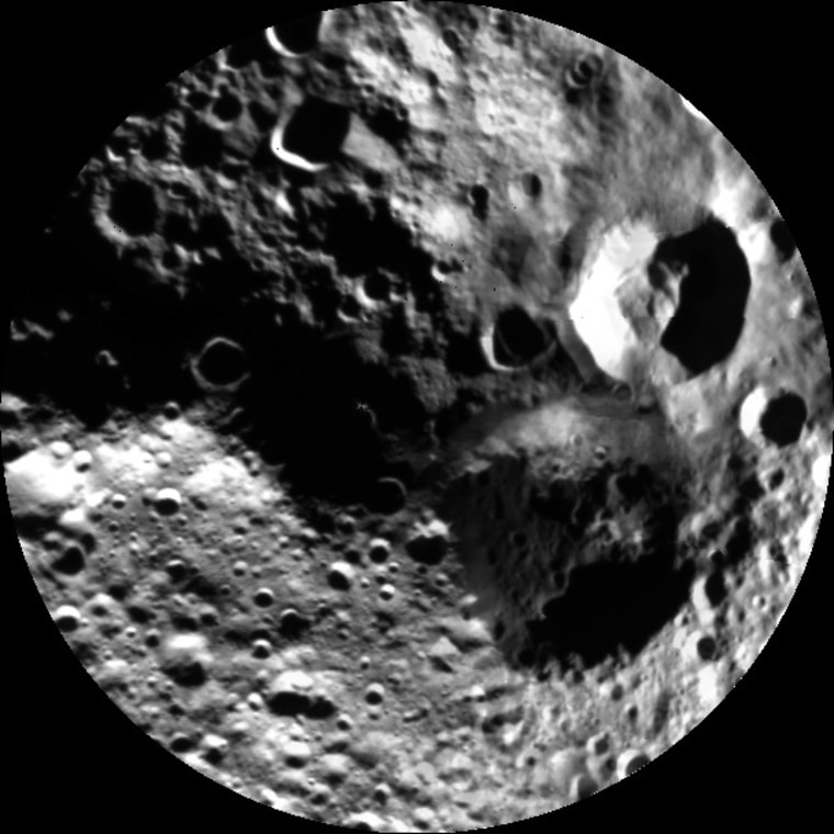 This image from NASA's Dawn mission, released Sept. 10, shows a shadowy view of the asteroid Vesta's northern hemisphere, using pictures obtained during Dawn's last look back. The mosaic is composed of five images obtained by Dawn's framing camera on Aug. 26, while the probe was at an altitude of 4,000 miles (6,000 kilometers).