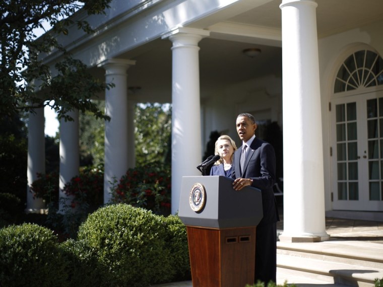 President Barack Obama delivers a statement alongside Secretary of State Hillary Clinton, following the death of the U.S. Ambassador to Libya, Chris Stevens, and others, in the Rose Garden of the White House in Washington, September 12, 2012.
