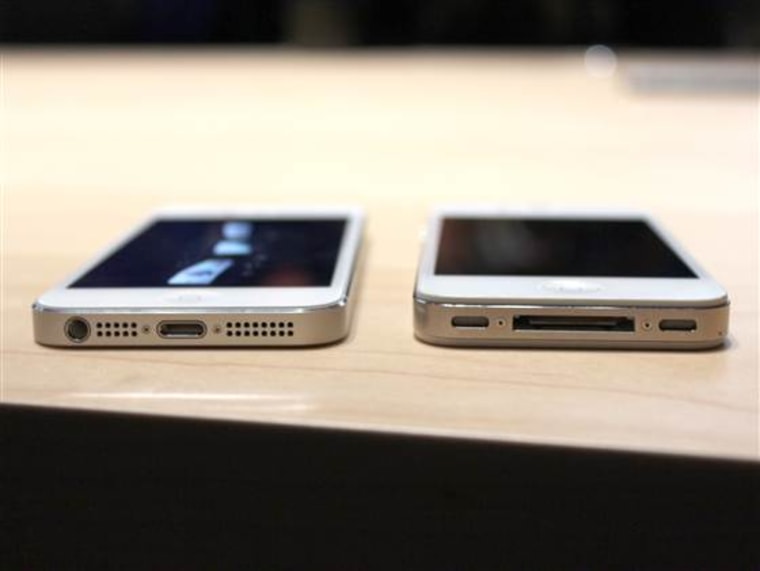 An iPhone 5 (left) next to an iPhone 4S.
