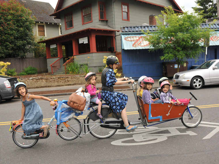 A bicycle built for... seven. Mom Emily Finch traded in her Suburban for a custom-built bicycle that she uses to pedal her six children, ages 2-11, around Portland, Ore.