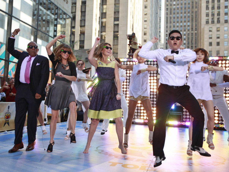 Korean rapper-singer Psy (R) performs on NBC's \"Today\" show with hosts (L-R) Al Roker, Natalie Morales and Savannah Guthrie in New York September 14, 2012. REUTERS/Brendan McDermid (UNITED STATES  - Tags: ENTERTAINMENT)