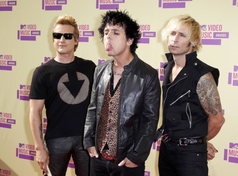 Hey, Bon Jovi! Green Day members Mike Dirnt, Billie Joe Armstrong and Tre Cool arrive for the MTV Video Music Awards on Sept. 6.