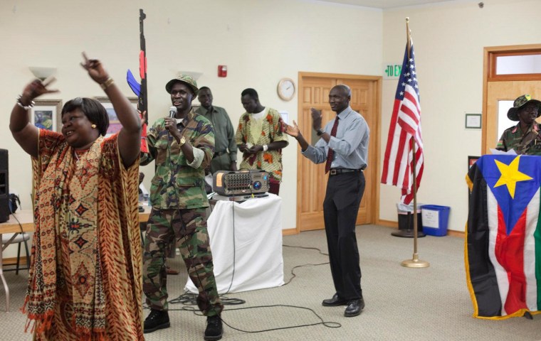 James Bior leads a song in memory of John Garang, the late leader of the Sudan People's Liberation Army, during a celebration for new nation of South Sudan, held at the Church by the Side of Road in Tukwila, Washington.