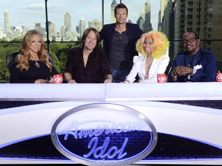 \"American Idol\" host Ryan Seacrest (center) joins Mariah Carey, Keith Urban, Nicki Minaj and Randy Jackson.