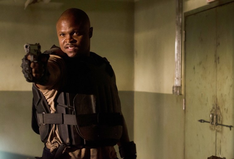 T-Dog (Robert \"IronE\" Singleton) takes aim in an exclusive photo AMC shared with us from season three.