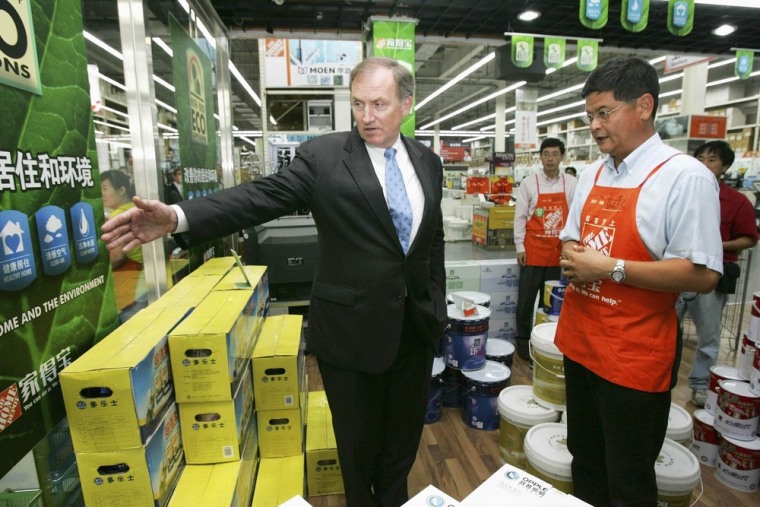Lost in translation? Home Depot, the world's largest home improvement chain, will close all seven of its big box stores and cut 850 jobs in China as the retailer changes its focus in the Chinese market. Shown here at better times: Former U.S. Treasury Deputy Secretary Robert Kimmitt looks at products with Home Depot (China) President Yves Chen during a visit to a Home Depot Store in Beijing in this file photo