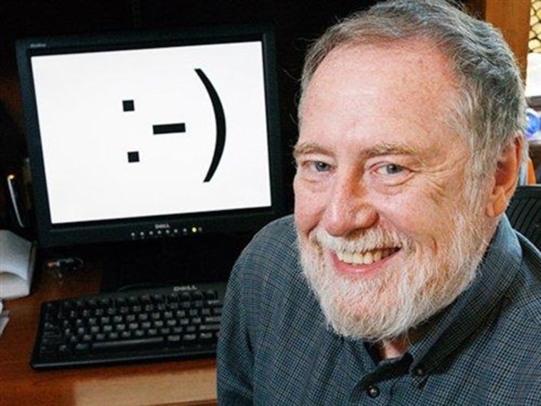 Carnegie Mellon professor Scott E. Fahlman is shown in his home office next to a his invention — the smiley face emoticon.