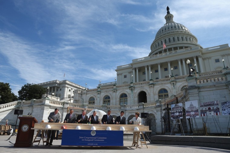 (L-R) Architect of the Capitol Stephen Ayers, Sen. Charles Schumer, Sen. Lamar Alexander, Senate Majority Leader Harry Reid, Speaker of the House John Boehner, House Majority Leader Eric Cantor, and House Minority Leader Nancy Pelosi swing their hammers during the