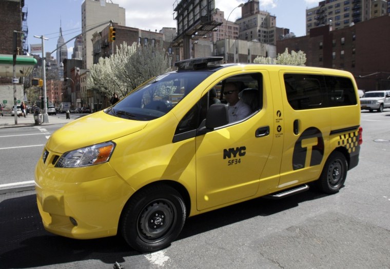 A prototype of the Nissan NV200 taxi is off-loaded from a truck April 2 in New York. The city's Taxi and Limousine commission approved the new fleet of Nissan cabs on Thursday.