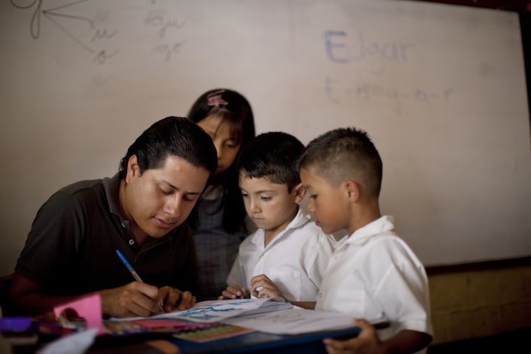 Linda Elizabeth Tylor Martinez works with students during class at a public school in the El Milagro neighborhood of Guatemala City, July 4.