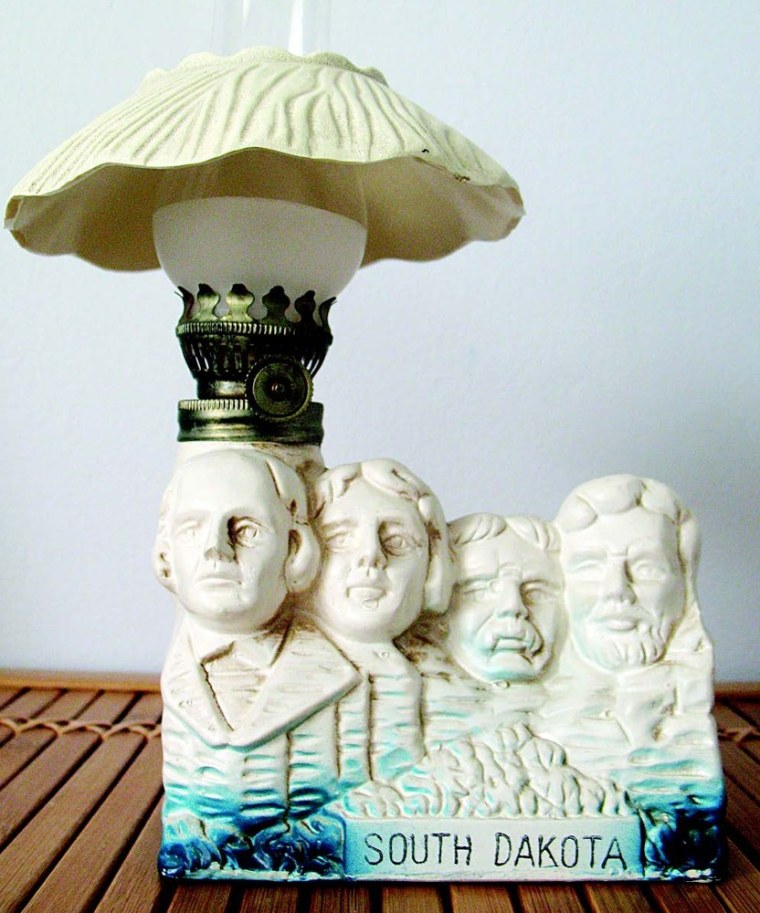 No, really, you shouldn't have! This miniature version of Mount Rushmore doubles as a lamp.