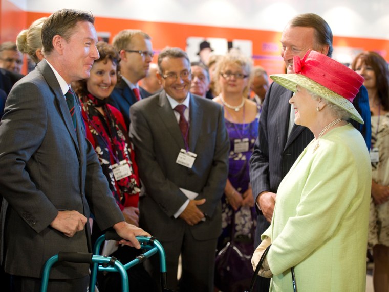 Queen Elizabeth II meets BBC journalist Frank Gardner at an event in October 2011. The BBC apologized on Tuesday after Gardner reported a conversation with the queen.