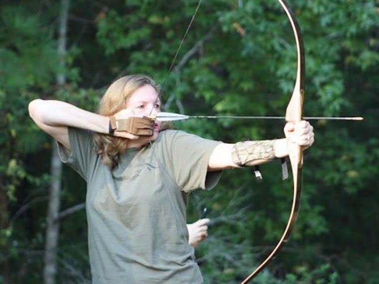 NBC News reporter Maggie Fox takes aim during an archery class.