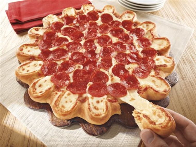 This undated product image provided by Pizza Hut shows the company's new pizza crust made of little cheese-stuffed bread bowls.