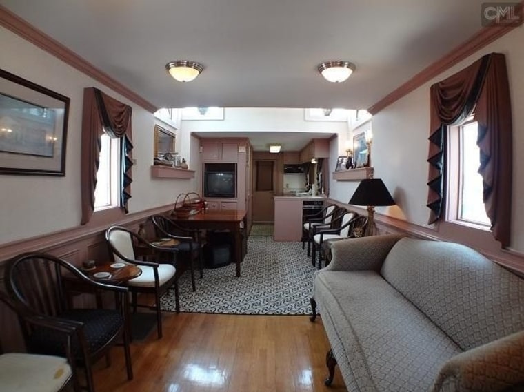 Each caboose has a kitchenette, a bathroom and a deck for viewing the stadium.