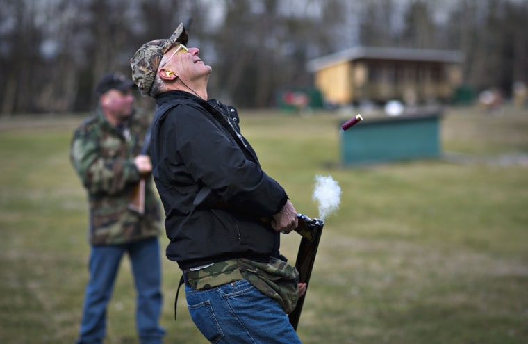 Rich Korbus reacts after missing his shot while trap shooting.