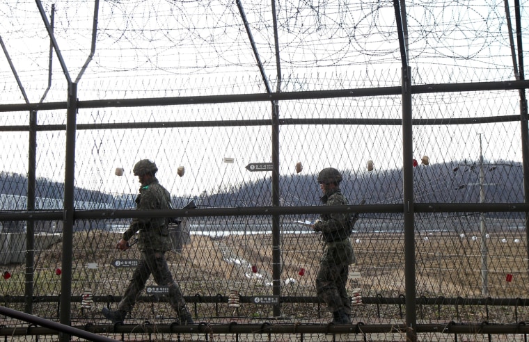 South Korean soldiers patrol at the border with North Korea in the Demilitarized Zone (DMZ) near Imjingak in Gyeonggi-do Province, South Korea, on April 2. North Korea said it plans to restart its five megawatt nuclear reactor that was shut down under an agreement reached at the six-party talks in 2007, a move that will allow the North to extract plutonium from spent fuel rods.