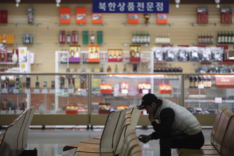 A man uses his mobile phone in front of a specialty shop selling North Korean products, at South Korea's CIQ (Customs, Immigration and Quarantine) office, just south of the demilitarised zone separating the two Koreas, in Paju, north of Seoul, on April 3. North Korean authorities were not allowing any South Korean workers into a joint industrial park on Wednesday, South Korea's Unification Ministry and a Reuters witness said, adding to tensions between the two countries.