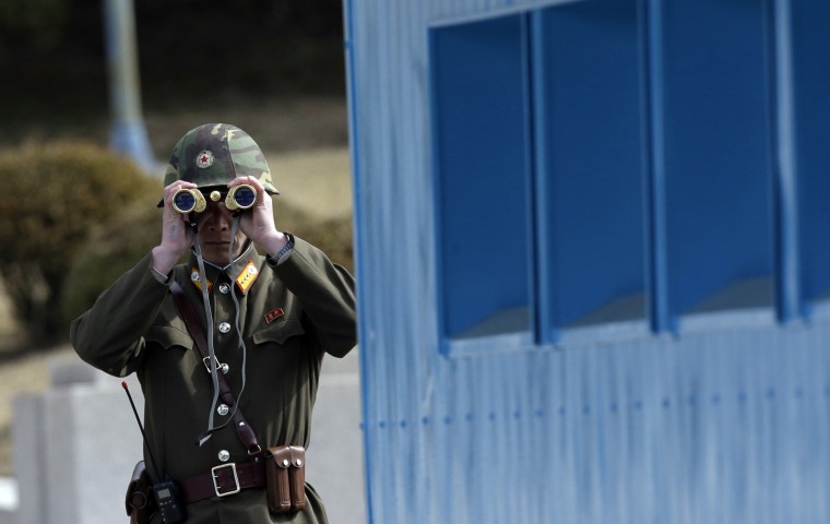 A North Korean soldier looks at the southern side through a pair of binoculars at the border village of the Panmunjom (DMZ) that separates the two Koreas since the Korean War, in Paju, north of Seoul, South Korea, on March 19. The United States is flying nuclear-capable B-52 bombers on training missions over South Korea to highlight Washington's commitment to defend an ally amid rising tensions with North Korea, Pentagon officials said.