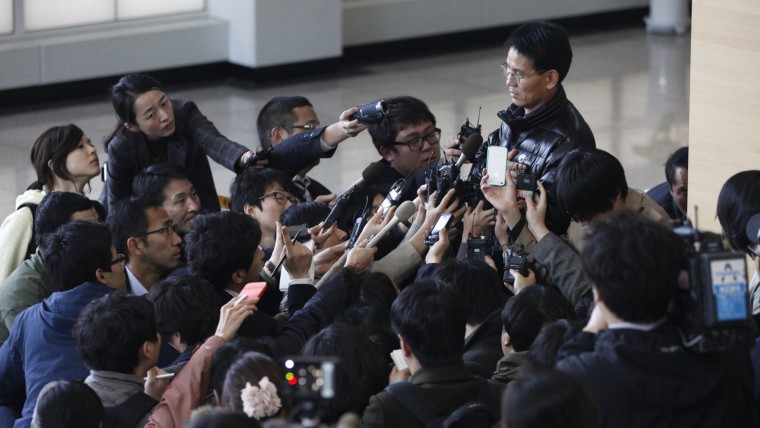 A South Korean employee, top right, working at the Kaesong Industrial Complex (KIC), speaks to the media upon his arrival at South Korea's CIQ (Customs, Immigration and Quarantine) office, just south of the demilitarised zone separating the two Koreas, in Paju, north of Seoul, April 3. North Korean authorities were not allowing any South Korean workers into a joint industrial park on Wednesday, South Korea's Unification Ministry and a Reuters witness said, adding to tensions between the two countries.