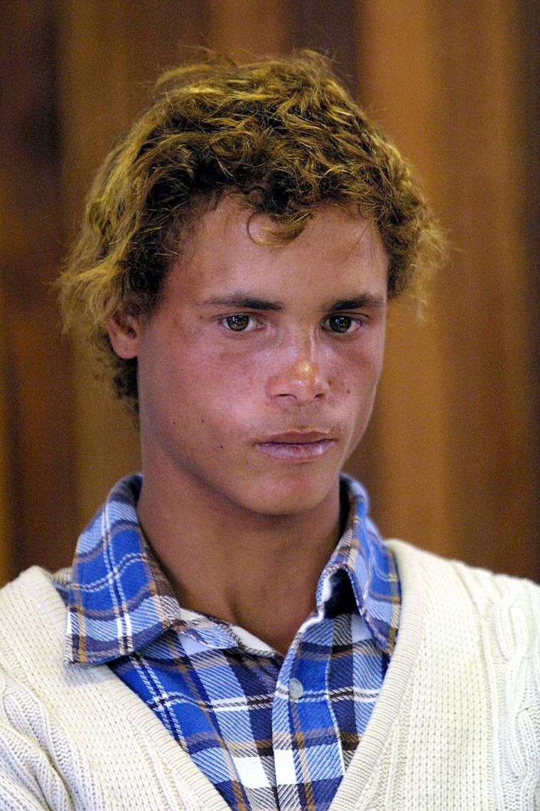 Happy Sindane is shown at a Pretoria, South Africa, police station in 2003, when he was about 18. He became famous in racially sensitive South Africa after claiming that he was white and had been abducted by a black family. He was found slain on Monday.