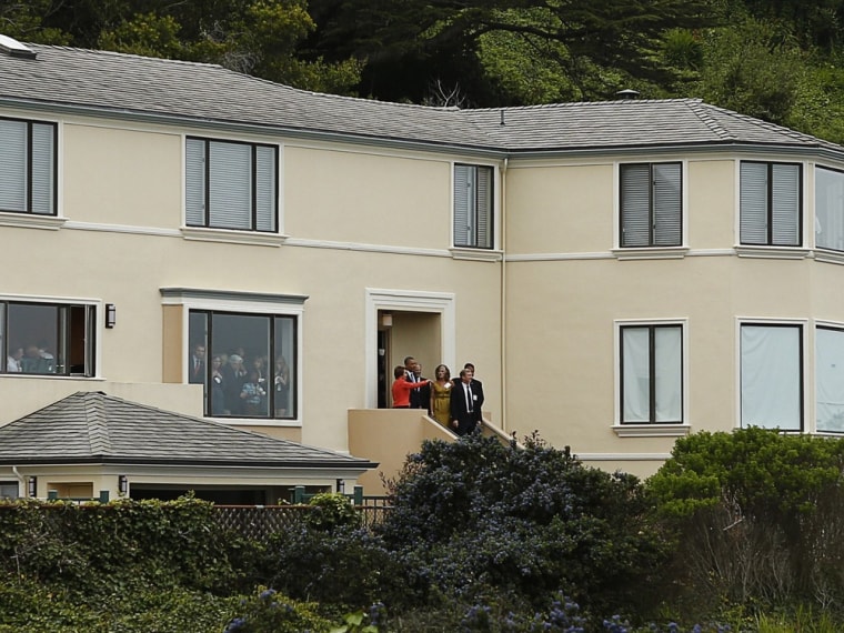 President Barack Obama looks out as House Democratic Leader Nancy Pelosi (in red) points out toward the ocean during a Democratic fund raiser at the home of billionaire former asset manager Tom Steyer in San Francisco April 3, 2013.