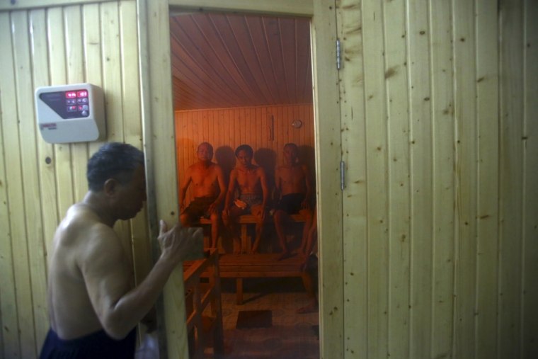 A patient enters a sauna room.