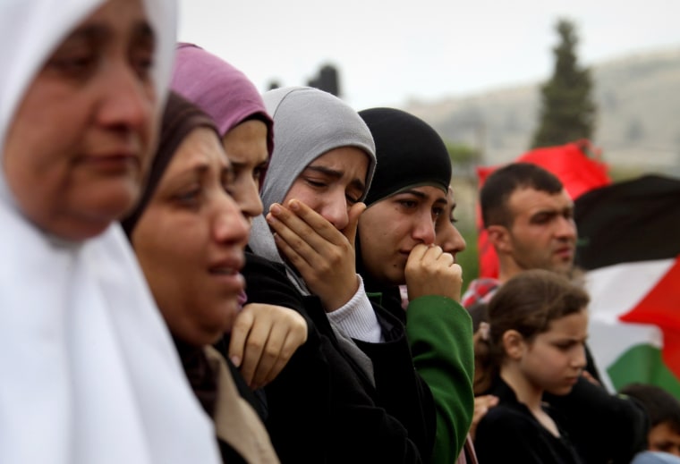 Palestinian women mourn during the funeral of Amer Nassar and Naji Balbisi in Anabta village near the West Bank city of Tulkarem on Thursday.