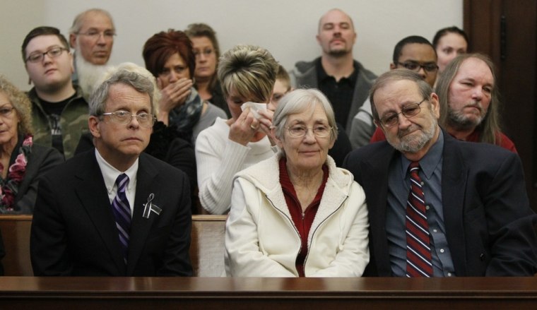 Ohio Attorney General Michael DeWine , left, sits with Ellen and Jack Kern, parents of victim Timothy Kern, as they listen to the sentencing in Richard Beasley's capital murder case.