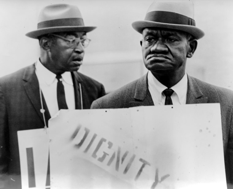 Sanitation workers the Rev. Theodore Hibbler, left, and Ted Brown march in downtown Memphis on March 29, 1968, the day after the famous sanitation strike march led by Dr. Martin Luther King Jr. was shattered by violence.