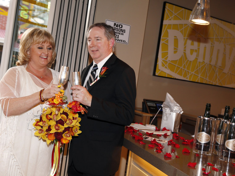 Nancy and Steven Keller toast following their wedding ceremony.