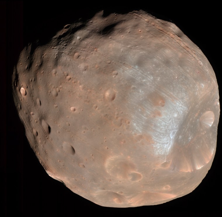 Contest asked the question: How do we get here? NASA's Mars Reconnaissance Orbiter took this image of the larger of Mars' two moons, Phobos, from a distance of about 6,800 km (about 4,200 miles).