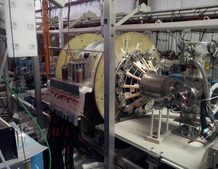 UW's Plasma Dynamics Lab has a vacuum chamber that is surrounded by two large, high-strength aluminum magnets. These magnets are powered by energy-storage capacitors that are connected by cables. The chamber is used to test a fusion-driven rocket technology.