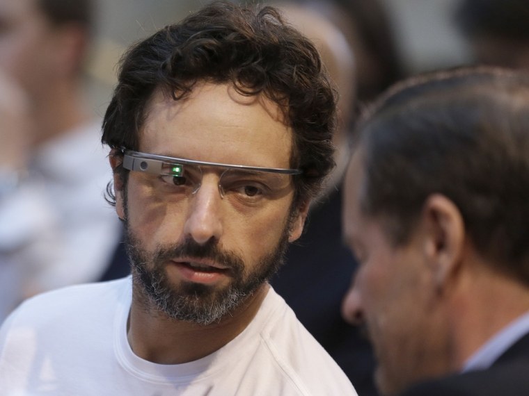 Google co-founder Sergey Brin, left, wears Google Glass glasses at an announcement for the Breakthrough Prize in Life Sciences at Genentech Hall on UC...