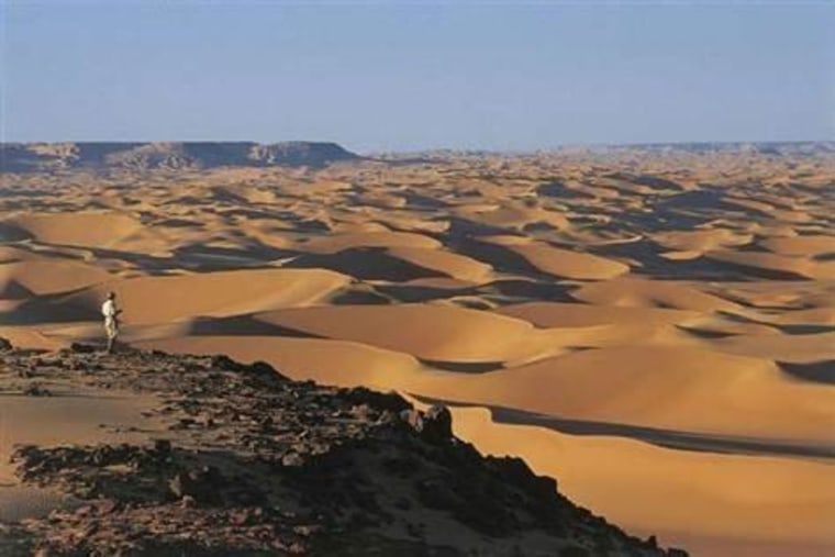 This is a view of the Great Sand Sea of Egypt from the Gilf Kebir Plateau in the Sahara desert.
